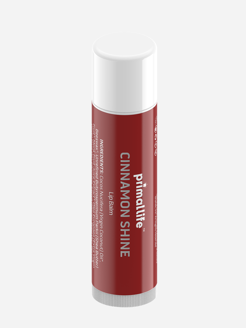 Red lip balm tube with white cap on a light gray background