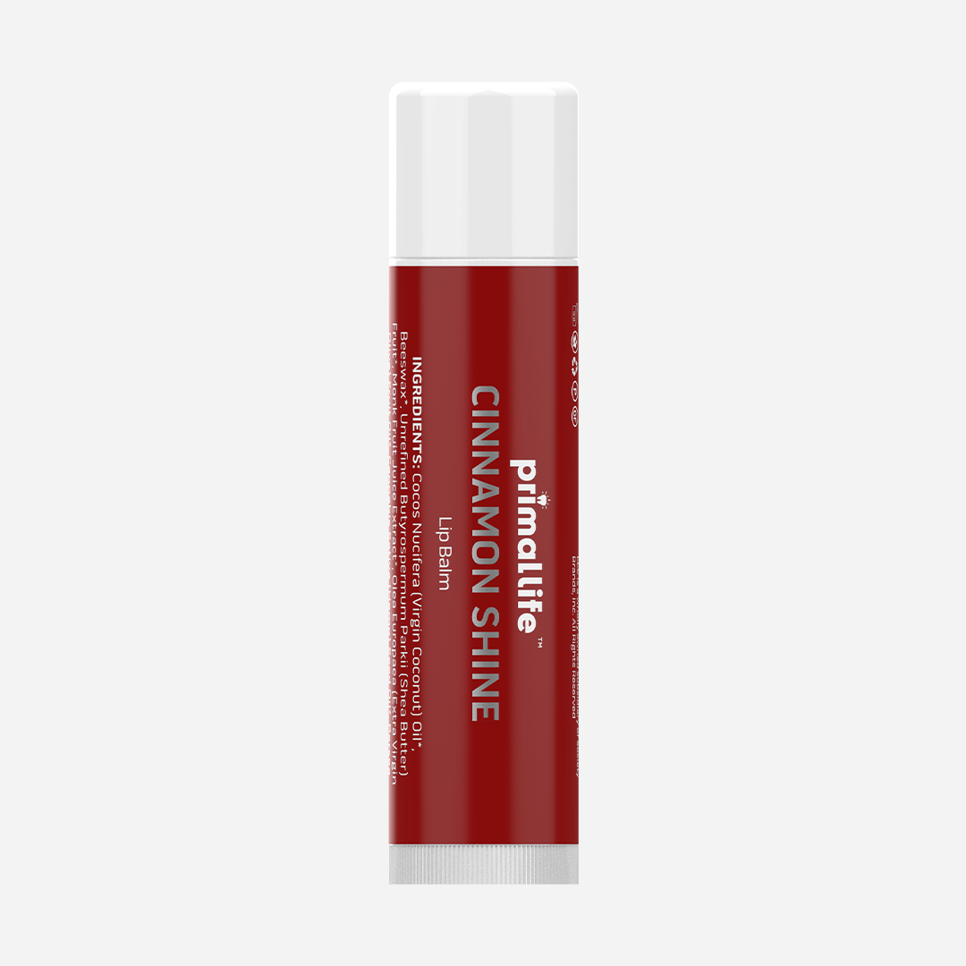 Red lip balm tube with white cap on a light gray background