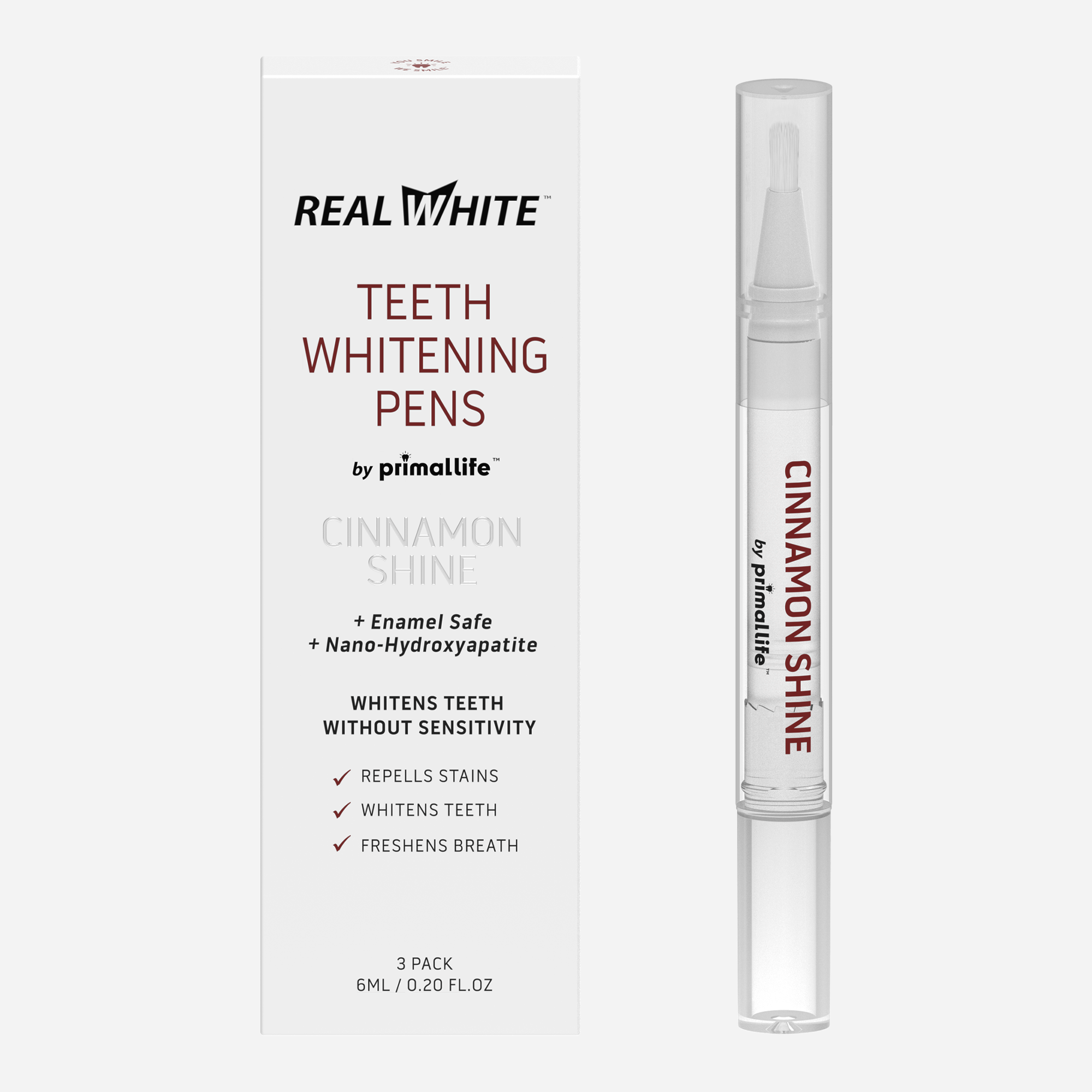 Real White teeth whitening pens with packaging on a white background